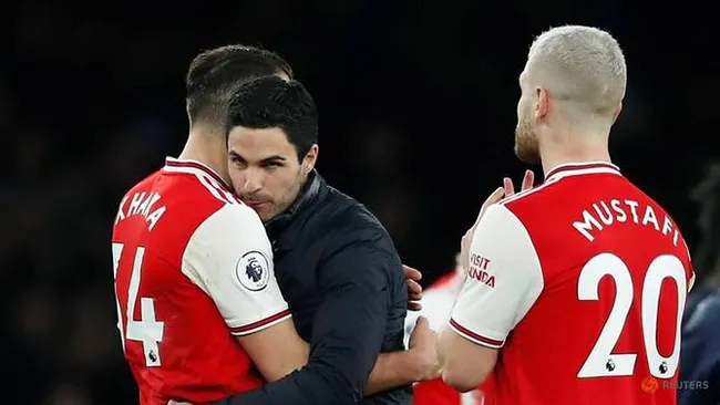 Soccer Football - Premier League - Arsenal v Everton - Emirates Stadium, London, Britain - February 23, 2020 Arsenal manager Mikel Arteta celebrates with Granit Xhaka and Shkodran Mustafi after the match. (Reuters)