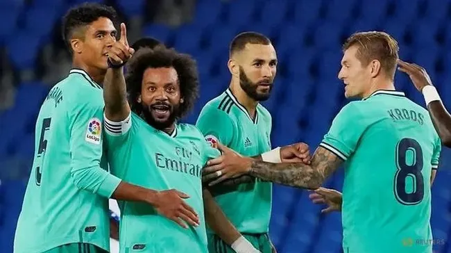 Real Madrid players celebrate scoring a goal during their match against Real Sociedad. (Photo: Reuters)