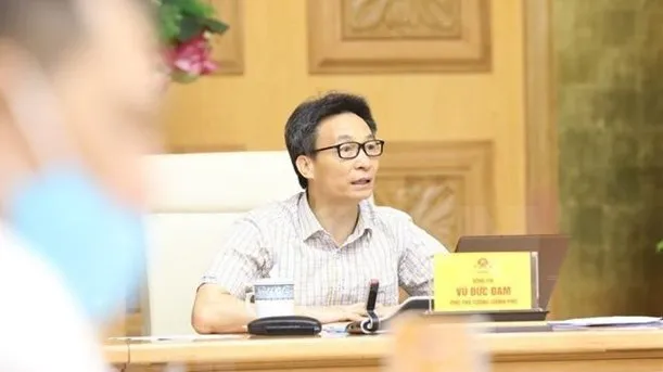 Deputy Prime Minister Vu Duc Dam chairs the meeting (Photo: VNA)