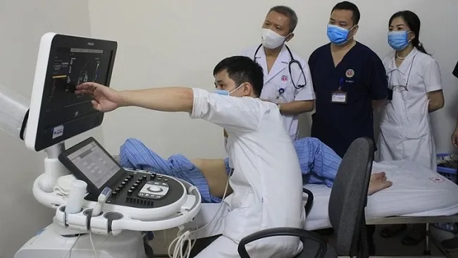 Doctors re-examine the patient after her surgery.