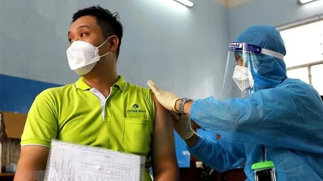 A Ho Chi Minh City resident is vaccinated against COVID-19. (Photo: VNA)