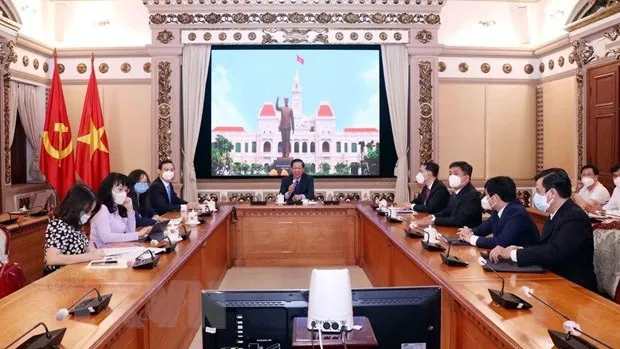 Chairman of the municipal People’s Committee Phan Van Mai at the virtual meeting with ADB Country Director for Vietnam Andrew Jeffries. (Photo: VNA)