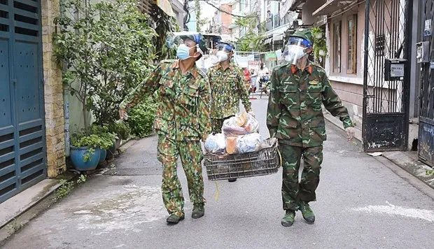 Social responsibility needed in the COVID-19 fight. (Photo: VNA)