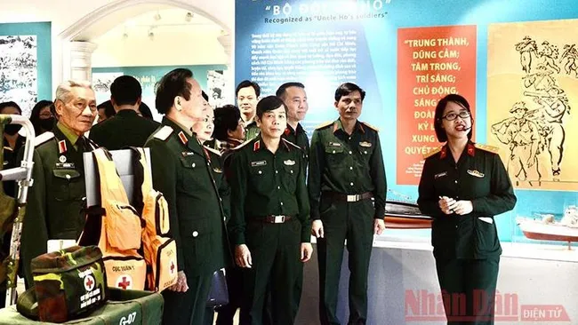 The Vietnam Military History Museum coordinates with the Army Youth Committee to organise an opening ceremony for an exhibition entitled “Army Youth - Stepping under the Party Flag”.