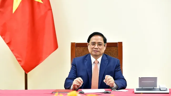 PM Pham Minh Chinh holds online talks with German Chancellor Angela Merkel. (Photo: VGP)