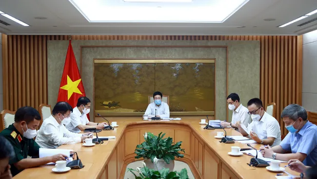 At the meeting (Photo: moh.gov.vn)