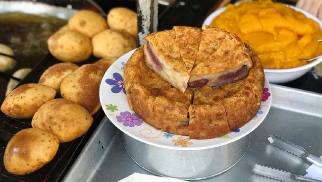 A stall sells banh tieu (L) in Vung Tau.
