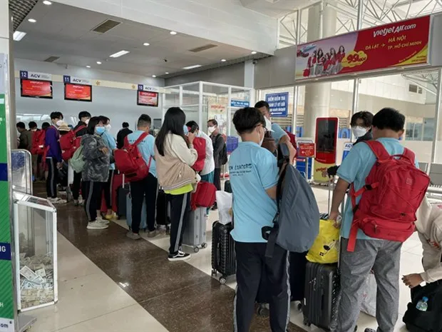 People check in at Lien Khuong airport in Da Lat City. Recovery in tourism along with spikes in domestic demand, FDI have contributed to Vietnam's high growth this year. (Photo: VNA)