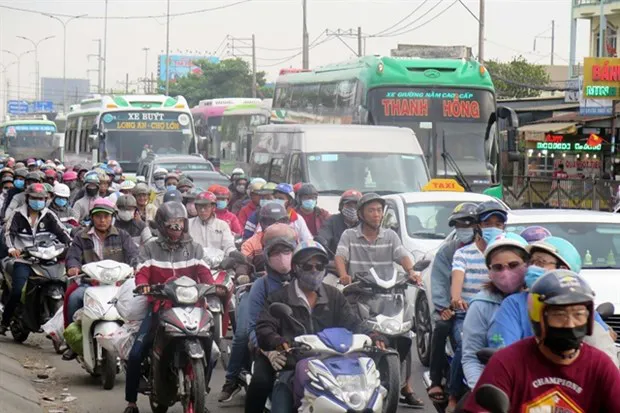 A large number of vehicles are stuck on National Highway No 1A in HCM City’s Binh Chanh district during peak hours. (Photo: VNA)