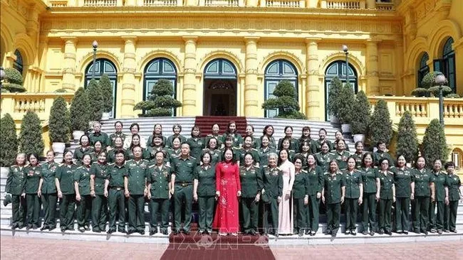 Vice President Vo Thi Anh Xuan (in red) and delegates at the event (Photo: VNA)
