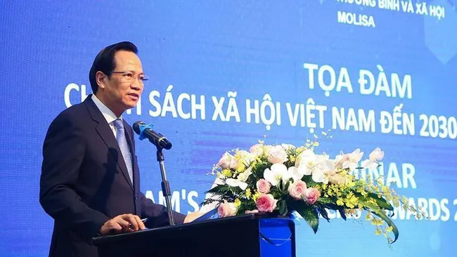 Minister of Labour, Invalids and Social Affairs Dao Ngoc Dung speaks at the seminar.