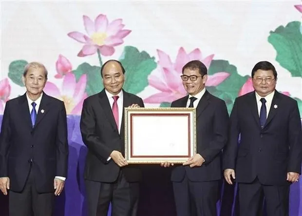 President Nguyen Xuan Phuc lauds Truong Hai Group Corporation (THACO), a multi-industry holding corporation, for its contributions to national economic development.(Photo: VNA)