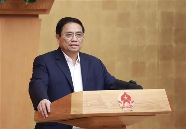 Prime Minister Pham Minh Chinh speaks at the meeting. (Photo: VNA)
