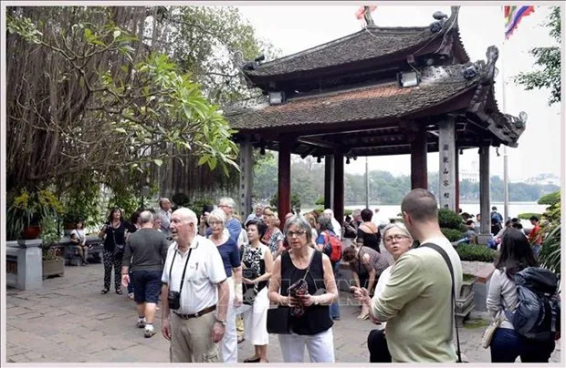 Foreign tourists visit Hanoi's Ngoc Son Temple. (Photo: VNA)