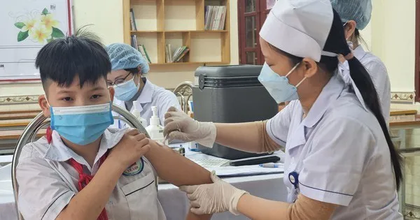 A boy is vaccinated against COVID-19.