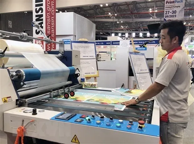 Latest technologies in the printing industry are introduced at the event. (Photo: VNA)