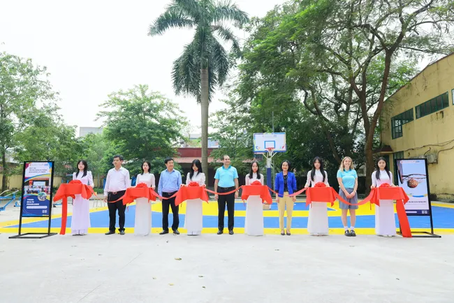 The ribbon-cutting ceremony for the basketball court sponsored by AstraZeneca through Plan International Vietnam, as part of the initiative.