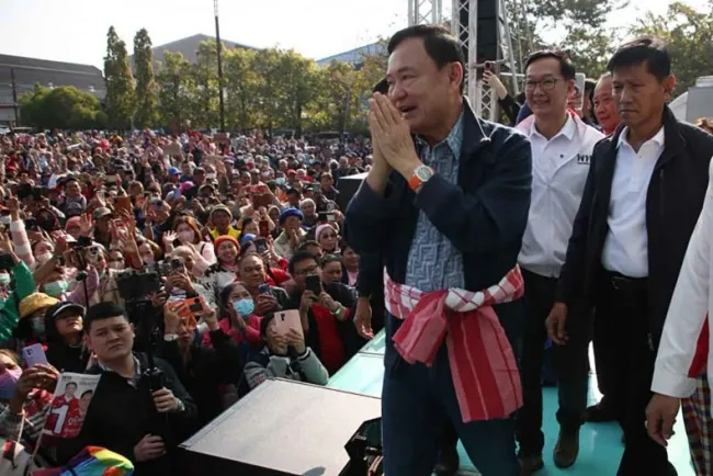 Thailand's former PM Thaksin Shinawatra greets supporters while campaigning in Bueng Kan province on Jan 19. (Photo: Pheu Thai Party)