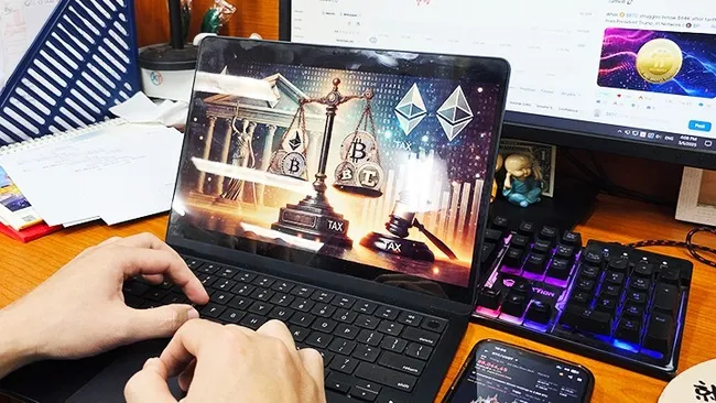 An investor watches the prices of cryptocurrencies.