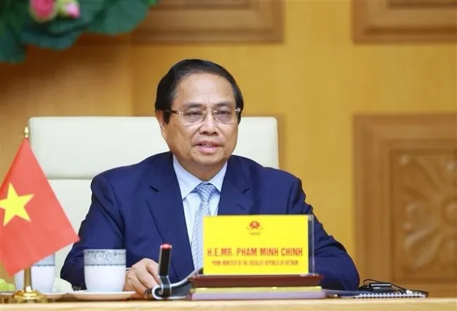 Prime Minister Pham Minh Chinh attends the virtual summit on climate action. (Photo: VNA)