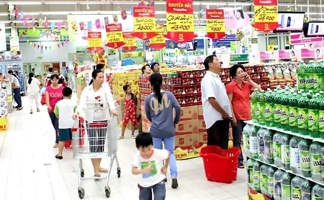 Customers at a supermarket in HCM City. The city faces rising inflation challenges. (Photo: VNA)