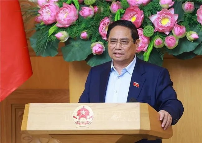 Prime Minister Pham Minh Chinh speaks at the meeting. (Photo: VNA)