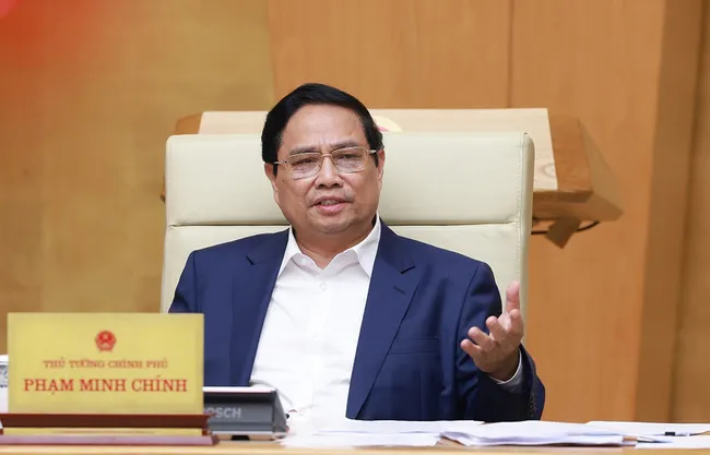 Prime Minister Pham Minh Chinh addresses the Government’s law-making session in Hanoi on July 23. (Photo: VNA)