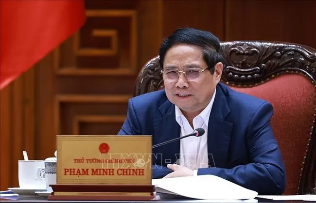 Prime Minister Pham Minh Chinh speaks at the working session on October 6. (Photo: VNA)
