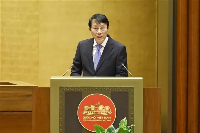 Minister of Public Security Luong Tam Quang presents the proposal on four draft laws at the National Assembly sitting on October 31. (Photo: VNA)