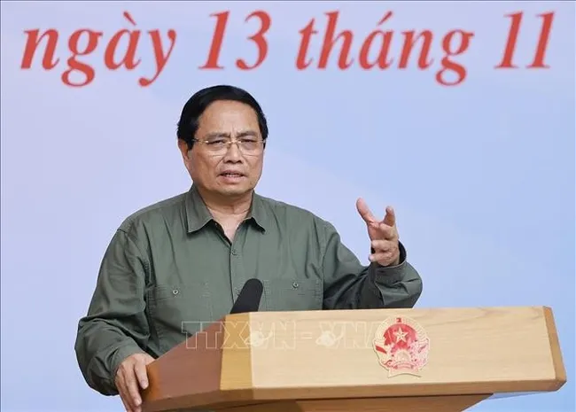 Prime Minister Pham Minh Chinh speaks at the November 13 meeting with leaders of ministries and central-level agencies, which is connected online with disaster-affected localities. (Photo: VNA)