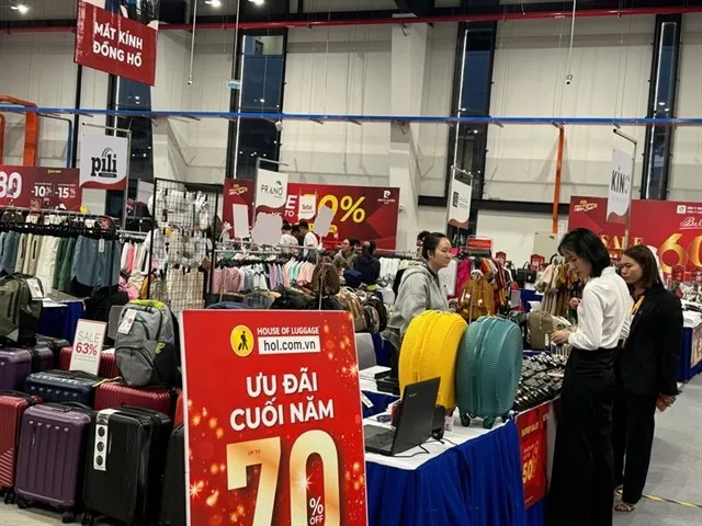 Visitors shop at the Shopping Seasons: Binh Duong Mega Sale programme being held in HCM City’s Binh Duong Ward from December 3-31. (Photo: VNA)