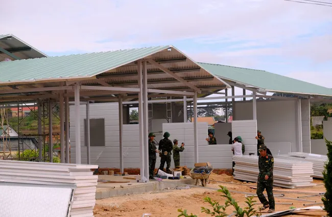 A bustling construction scene is recorded at four residential building sites under the 