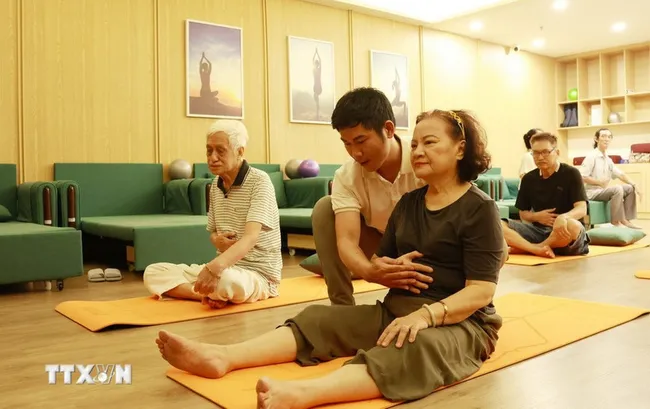 Elderly people take part in activities at a daytime care centre for senior citizens. (Photo: VNA)
