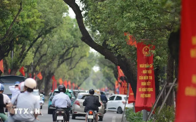 Main streets in Hue city are decorated with banners and propaga