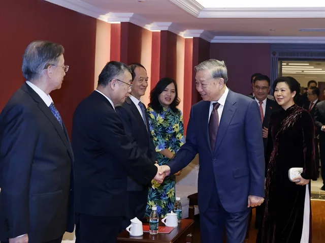 Việt Nam's top leader Tô Lâm and his spouse Ngô Phương Ly and relatives of Chinese generals, experts and others who had supported Việt Nam–China friendship in Beijing. — VNA/VNS Photo