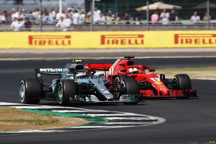 Sebastian Vettel giành chiến thắng kịch tính ở Silverstone, nới rộng khoảng cách trên bảng xếp hạng - Ảnh 2. Sebastian Vettel giành chiến thắng kịch tính ở Silverstone, nới rộng khoảng cách trên bảng xếp hạng - Ảnh 2.