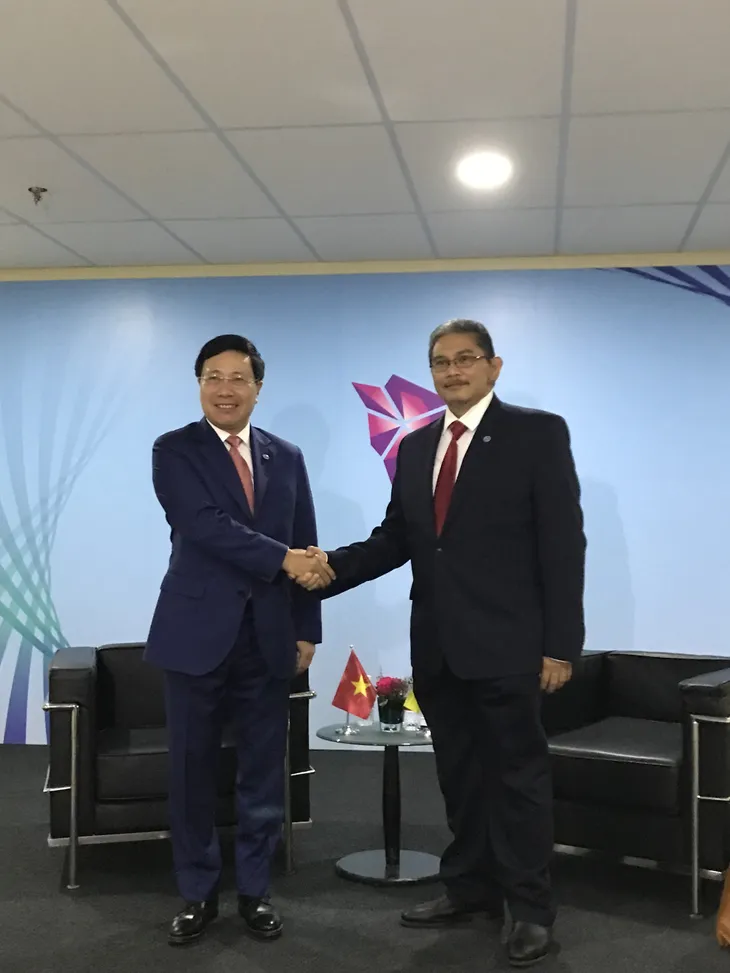 Các hoạt động song phương của Phó Thủ tướng Phạm Bình Minh tại Singapore - Ảnh 1. Các hoạt động song phương của Phó Thủ tướng Phạm Bình Minh tại Singapore - Ảnh 1.