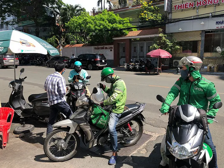 Tổng cục Thuế: “Cần làm rõ cách tính cước và mức khấu trừ với tài xế của Grab” - Ảnh 2.