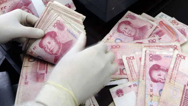 Trung Quốc triệt phá đường dây làm tiền giả trị giá 60 triệu USD - Ảnh 1. Trung Quốc triệt phá đường dây làm tiền giả trị giá 60 triệu USD - Ảnh 1.