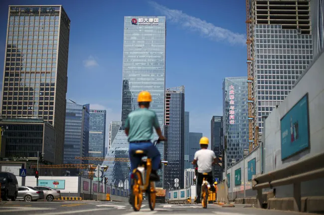 Những tác động sau khi Evergrande bị xếp hạng vỡ nợ - Ảnh 1. Những tác động sau khi Evergrande bị xếp hạng vỡ nợ - Ảnh 1.