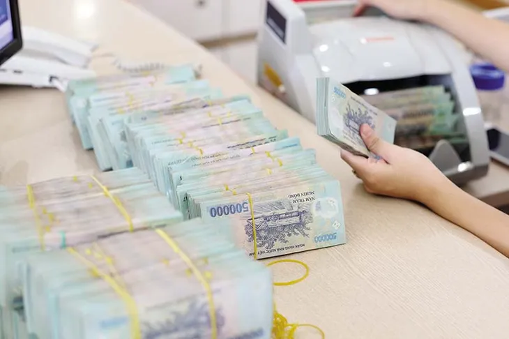 Nới hạn mức tín dụng, ngân hàng đẩy mạnh bơm vốn ra thị trường - Ảnh 1. Nới hạn mức tín dụng, ngân hàng đẩy mạnh bơm vốn ra thị trường - Ảnh 1.