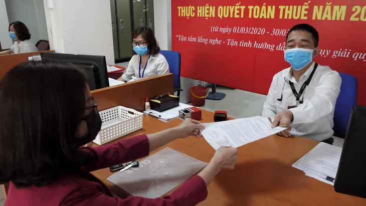 Ngành thuế nỗ lực đảm bảo nguồn thu ngân sách năm 2021 - Ảnh 1. Ngành thuế nỗ lực đảm bảo nguồn thu ngân sách năm 2021 - Ảnh 1.