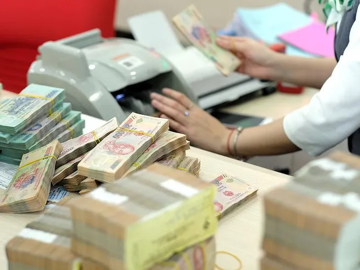 Ngân hàng lời lớn, nhưng không dễ giảm lãi suất cho vay - Ảnh 1. Ngân hàng lời lớn, nhưng không dễ giảm lãi suất cho vay - Ảnh 1.
