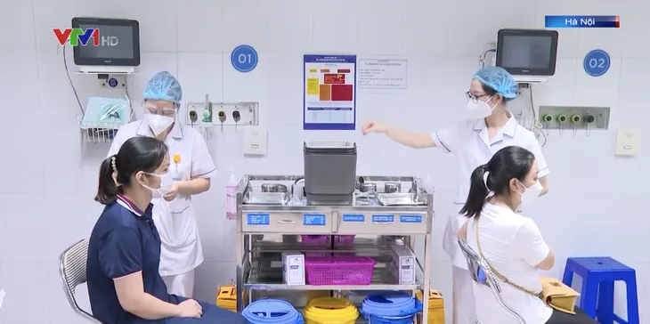 Hà Nội tiêm vaccine phòng COVID-19 cho phụ nữ mang thai - Ảnh 1. Hà Nội tiêm vaccine phòng COVID-19 cho phụ nữ mang thai - Ảnh 1.