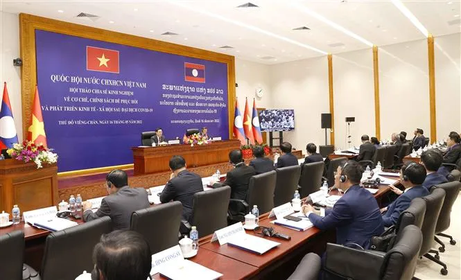 Việt Nam - Lào chia sẻ kinh nghiệm về phát triển kinh tế-xã hội sau đại dịch COVID-19 - Ảnh 3. Việt Nam - Lào chia sẻ kinh nghiệm về phát triển kinh tế-xã hội sau đại dịch COVID-19 - Ảnh 3.