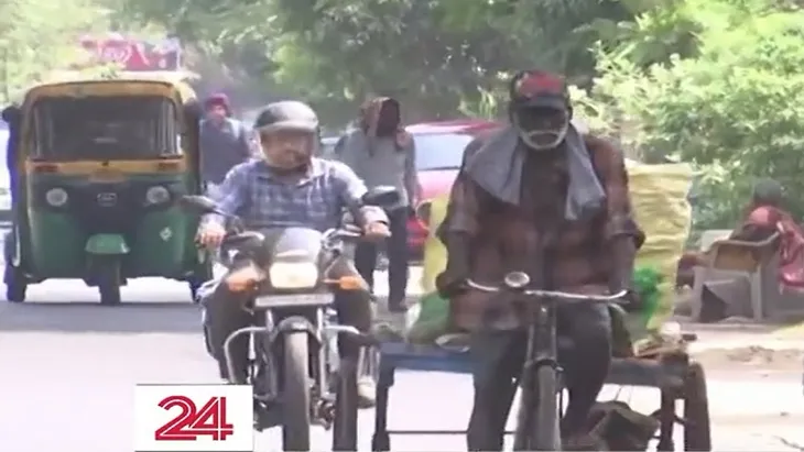 Người dân mệt mỏi trong cái nóng kỷ lục ở Ấn Độ - Ảnh 1. Người dân mệt mỏi trong cái nóng kỷ lục ở Ấn Độ - Ảnh 1.