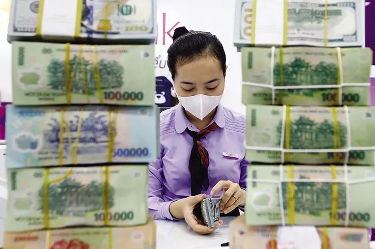 Nỗ lực ổn định mặt bằng lãi suất - Ảnh 2. Nỗ lực ổn định mặt bằng lãi suất - Ảnh 2.