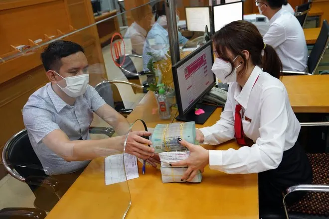 Ngân hàng tăng năng lực cho vay - Ảnh 2. Ngân hàng tăng năng lực cho vay - Ảnh 2.