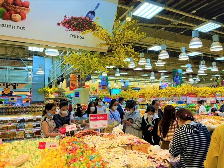 Sức mua dịp Tết tăng cao nhờ khuyến mãi - Ảnh 1. Sức mua dịp Tết tăng cao nhờ khuyến mãi - Ảnh 1.