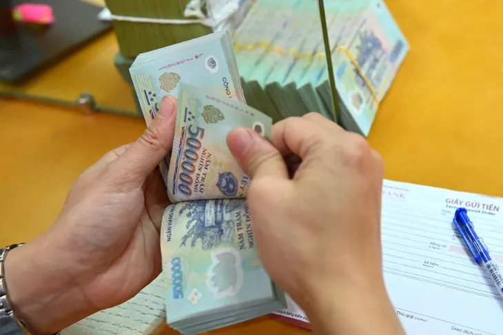 Ngân hàng nỗ lực xử lý nợ xấu - Ảnh 1. Ngân hàng nỗ lực xử lý nợ xấu - Ảnh 1.